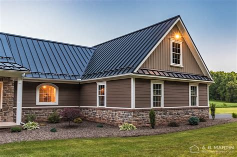 houses with black metal roof|exterior house colors black roof.